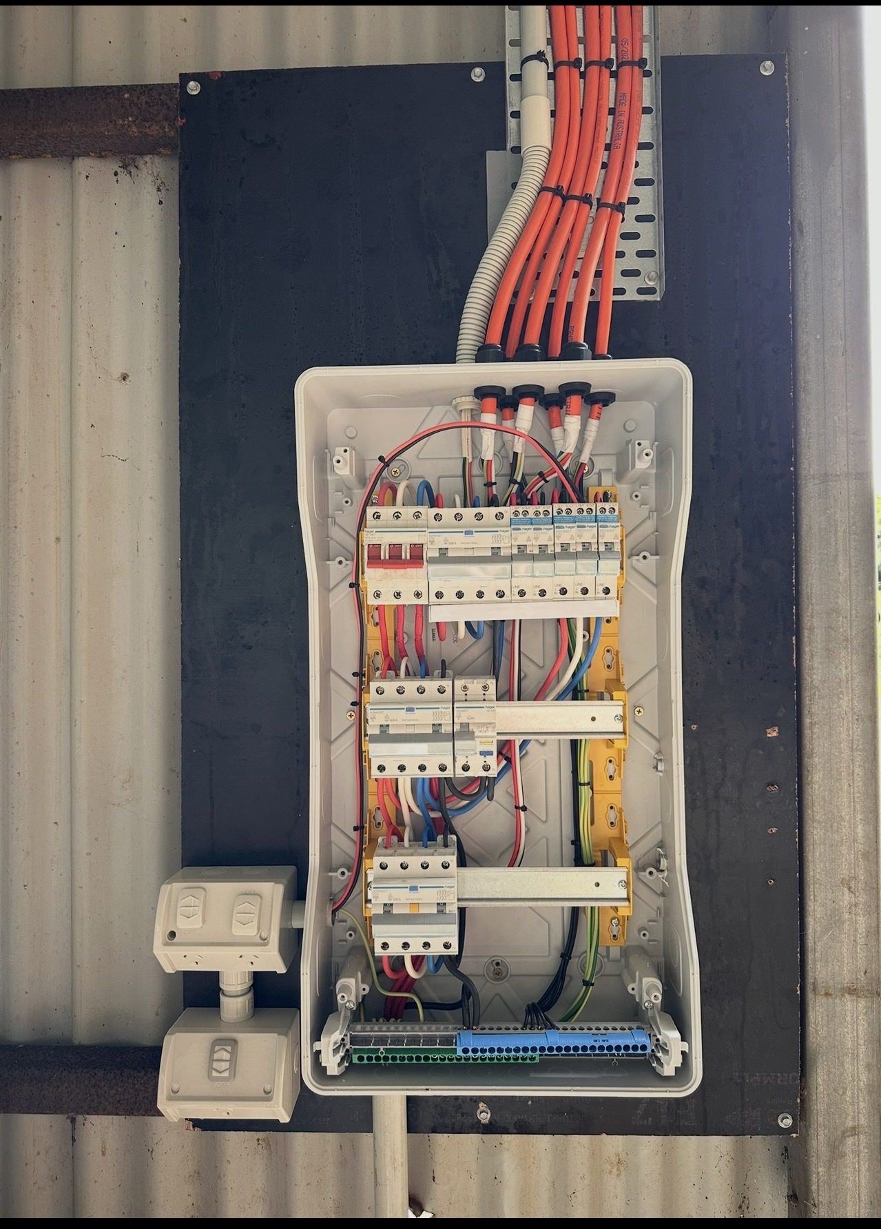 A newly installed switchboard, breakers labelled and wiring dressed in neatly